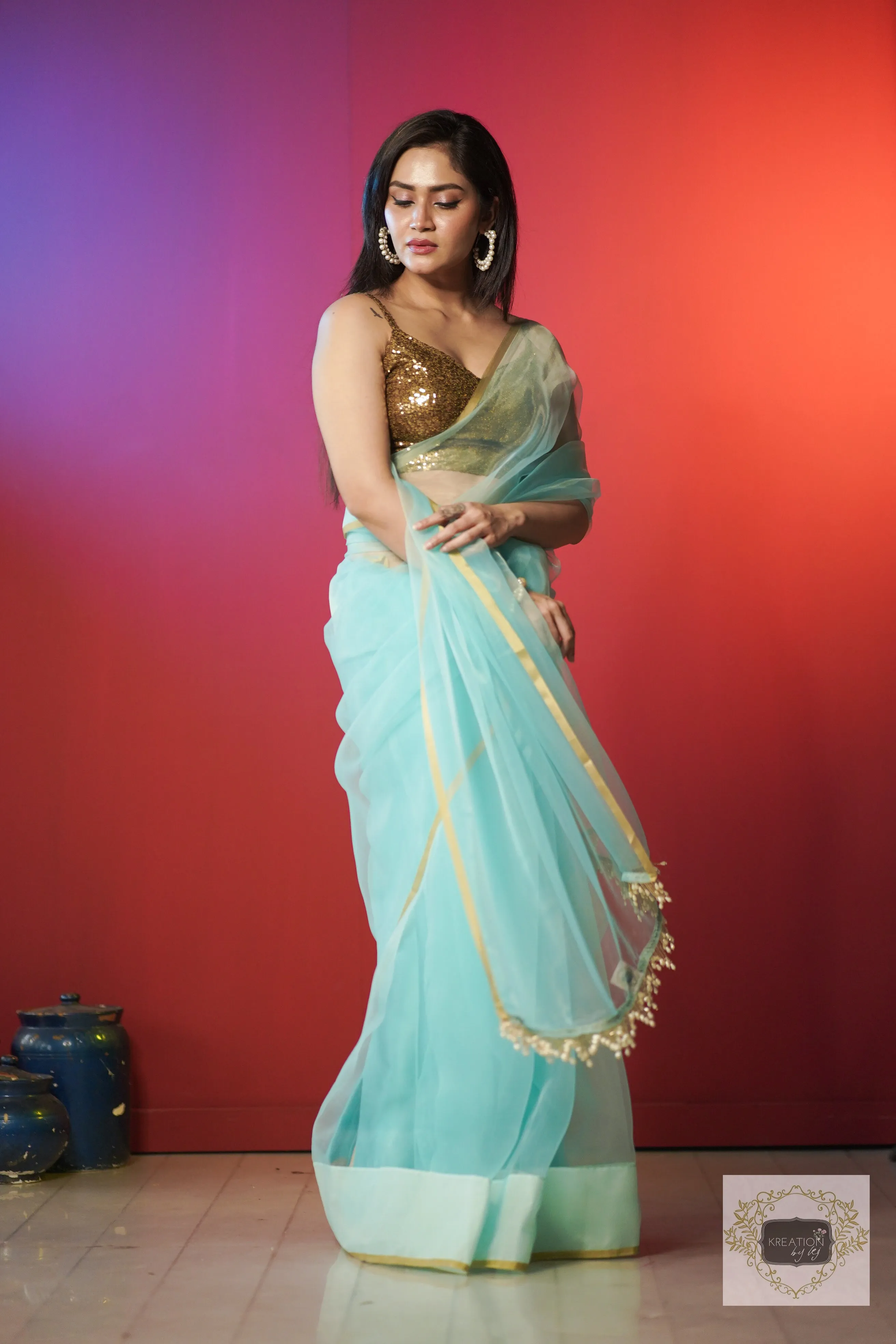 Ice Blue Organza Saree With Handmade Tassels On Pallu